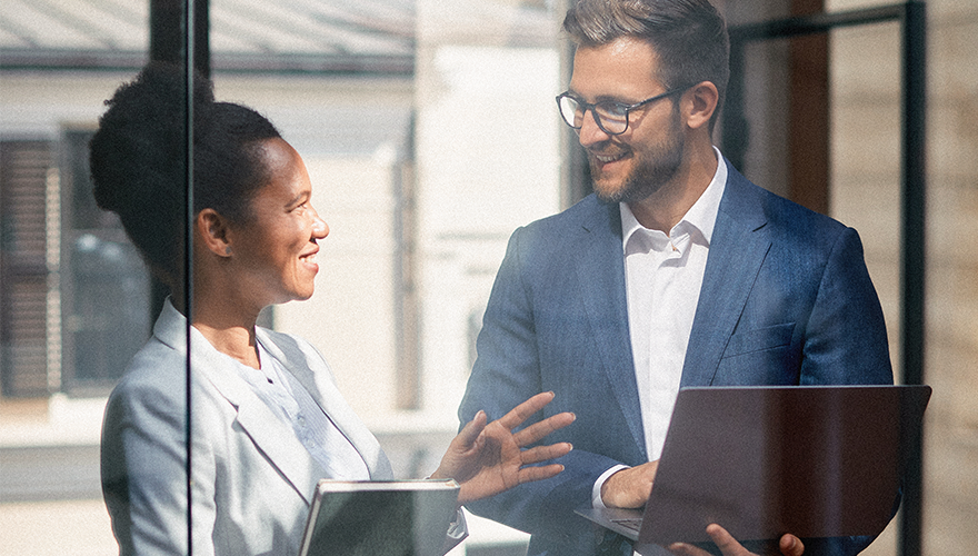 Photo of two coworkers talking