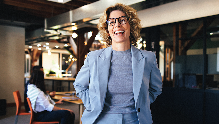 Photo of a business woman smiling and relaxed