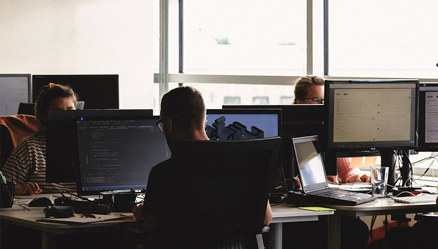 Photo of a team working at computers