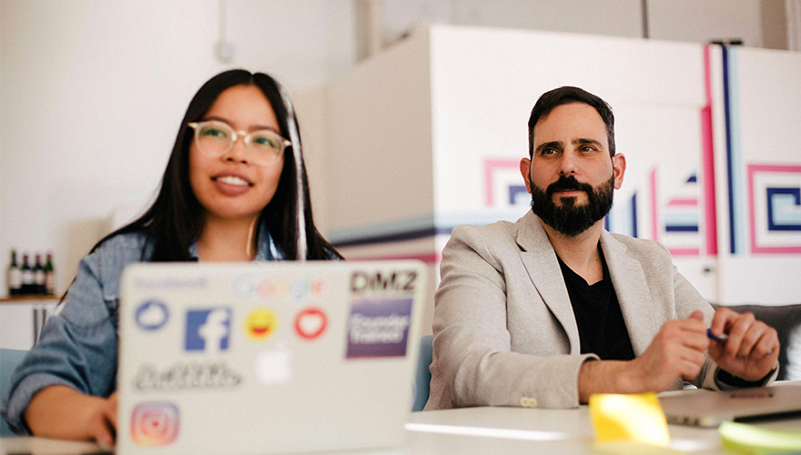 A photo of two colleagues in a meeting