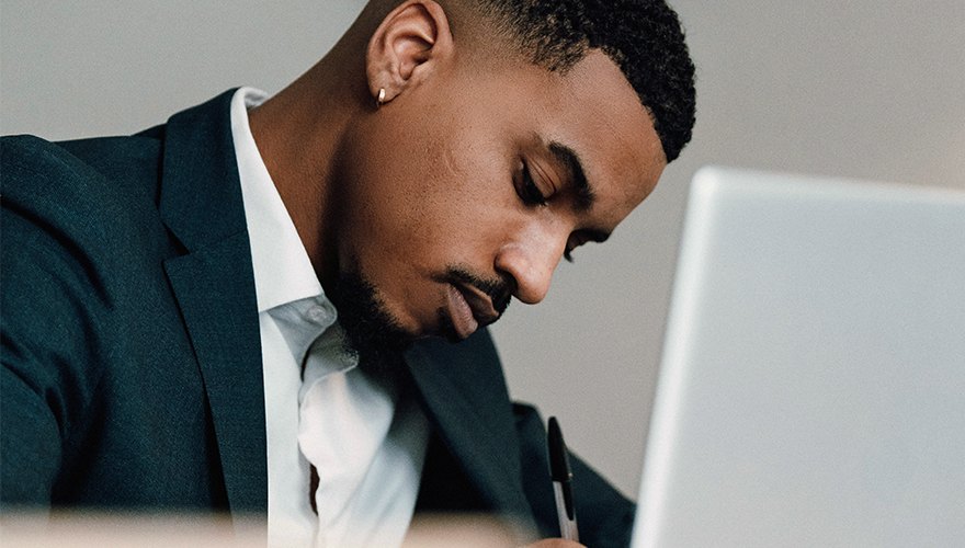 Photo of a man working on a computer