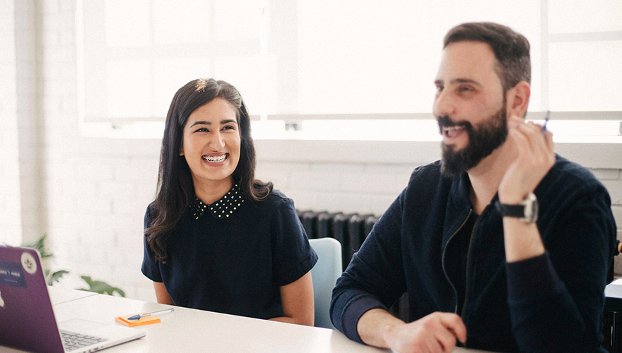 Photo of two colleagues in a conference room