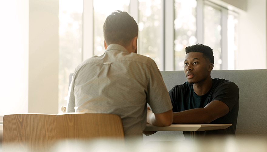 Photo of two men at a table