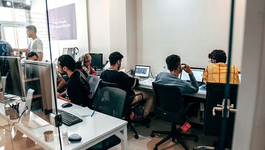 A photo of a team working in an office